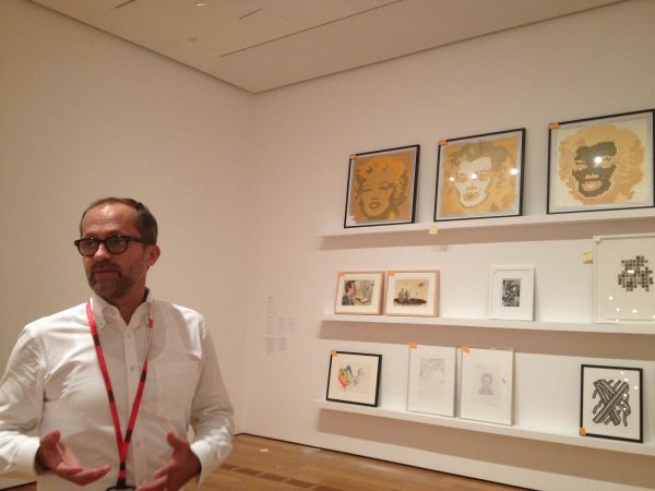 High Museum's Michael Rooks, in the gallery days before the opening of ''Sprawl,'' earned praise for his work in the art community.