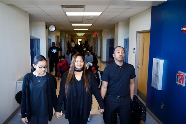 Washington High Student Government Association officers Mackenzie Hornsby (from left), Mercedes Williams and Markail Brooks helped organize the school's walkout Wednesday. (Dustin Chambers/WABE)