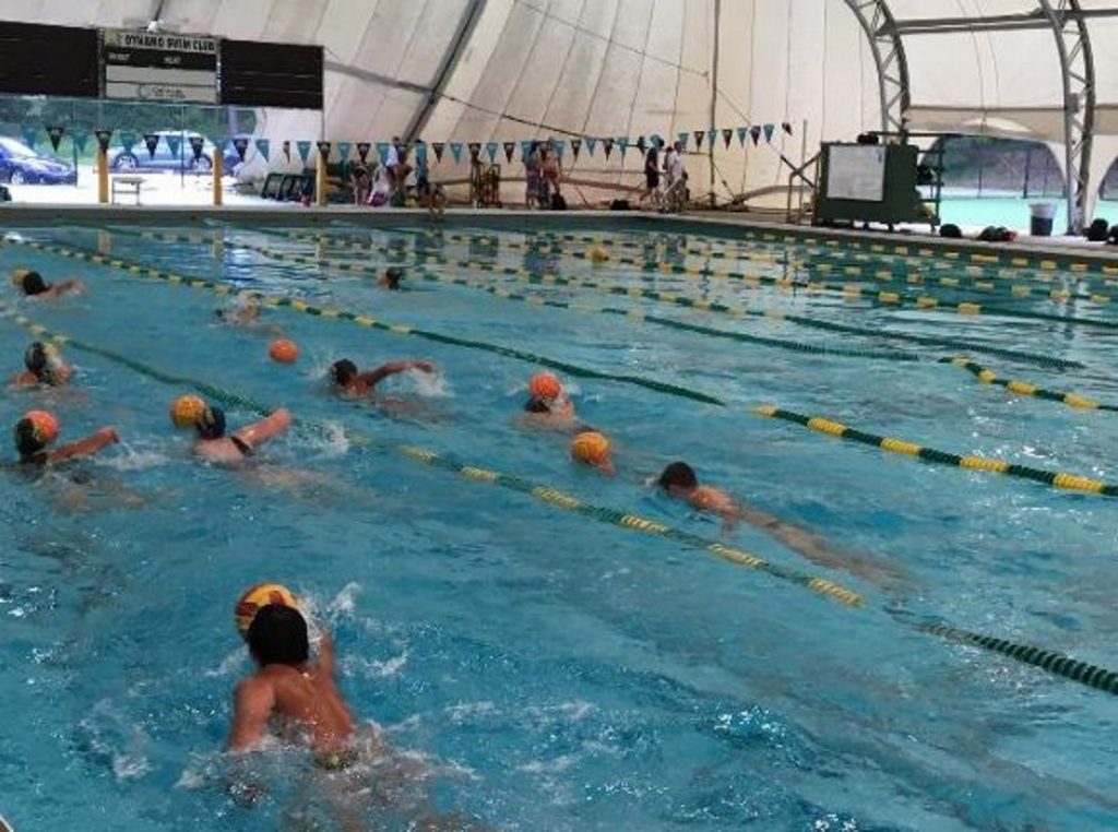 The team does drills during its final practice. Some of the team members are also competitive swimmers. (Martha Dalton/WABE)