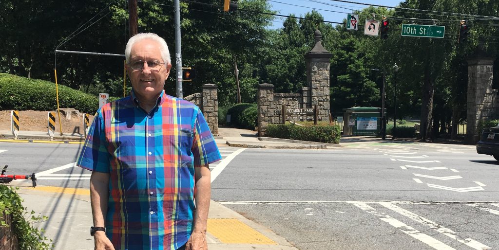 Jack Abbott stands near the finish line of the Peachtree Road Race. Abbott has been involved with the race for 45 years. This will be his last year as course director. Will he return next year as a participant? "Ask me next year," he says. (Courtney Kueppers/WABE)