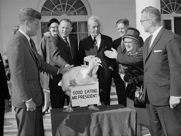 President John F. Kennedy accepts turkey.