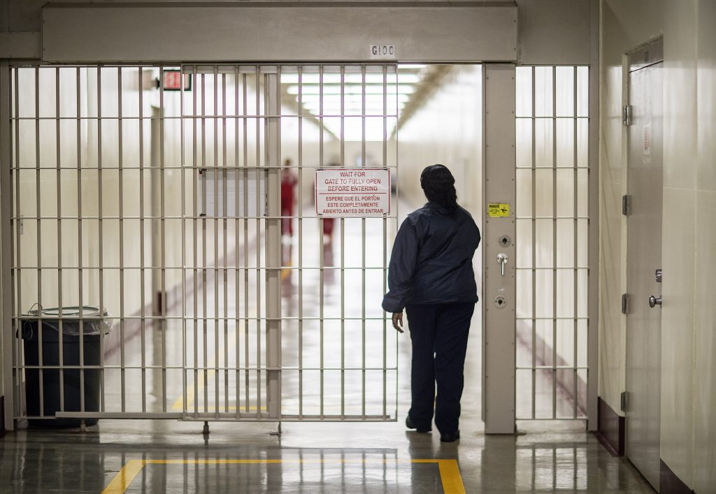 A detention officer walks through the halls at the Stewart Detention Center. The Detention Center sits in Lumpkin, a rural town about 140 miles southwest of Atlanta and right next to the Georgia-Alabama state line. 