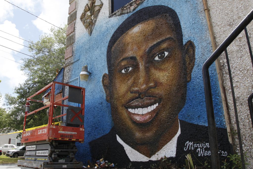 A mural of Ahmaud Arbery, painted last spring, is on display in Brunswick, Georgia, where the 25-year-old man was shot and killed in February.
