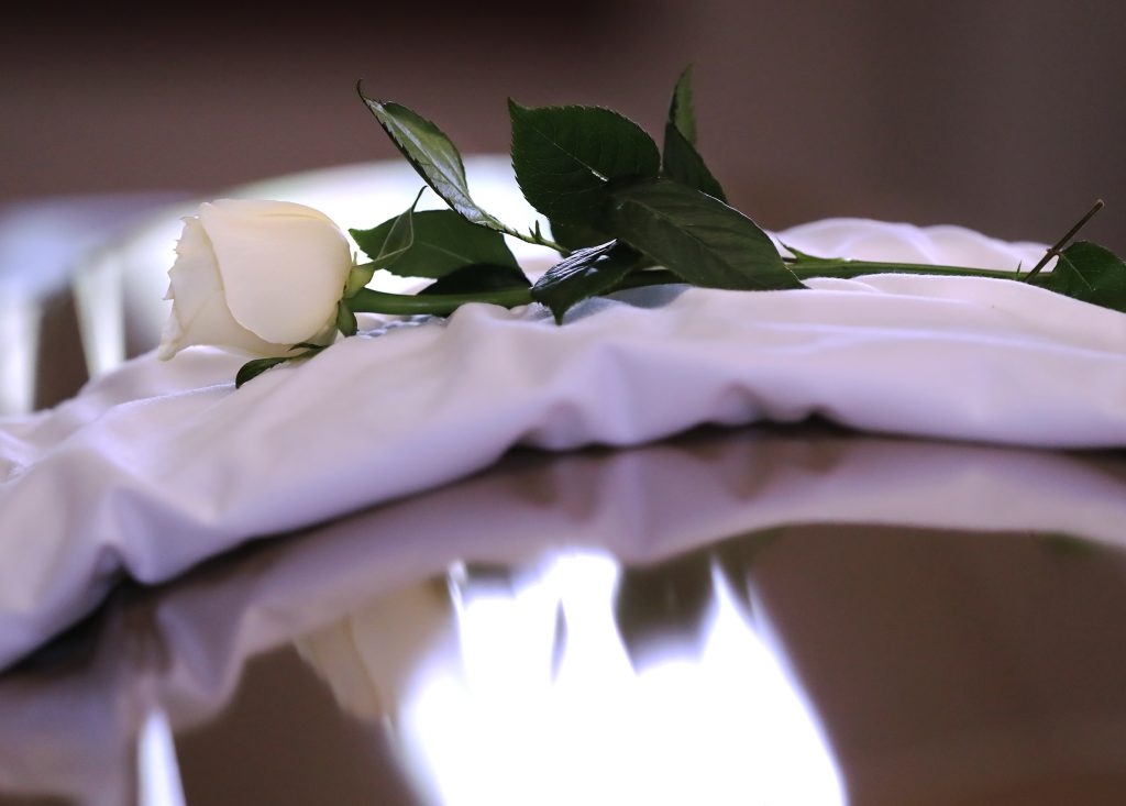 A single white rose sits on the coffin cover during Rayshard Brooks’ public viewing at Ebenezer Baptist Church on Monday in Atlanta.