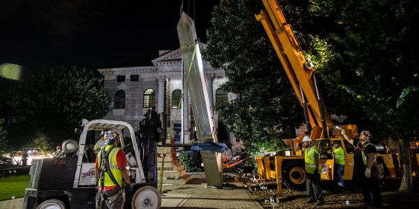 Workers remove a Confederate monument with a crane Thursday, June 18, 2020, in Decatur, Ga. The 30-foot obelisk in Decatur Square, erected by the United Daughters of the Confederacy in 1908, was ordered by a judge to be removed and placed into storage indefinitely. (AP Photo/Ron Harris)