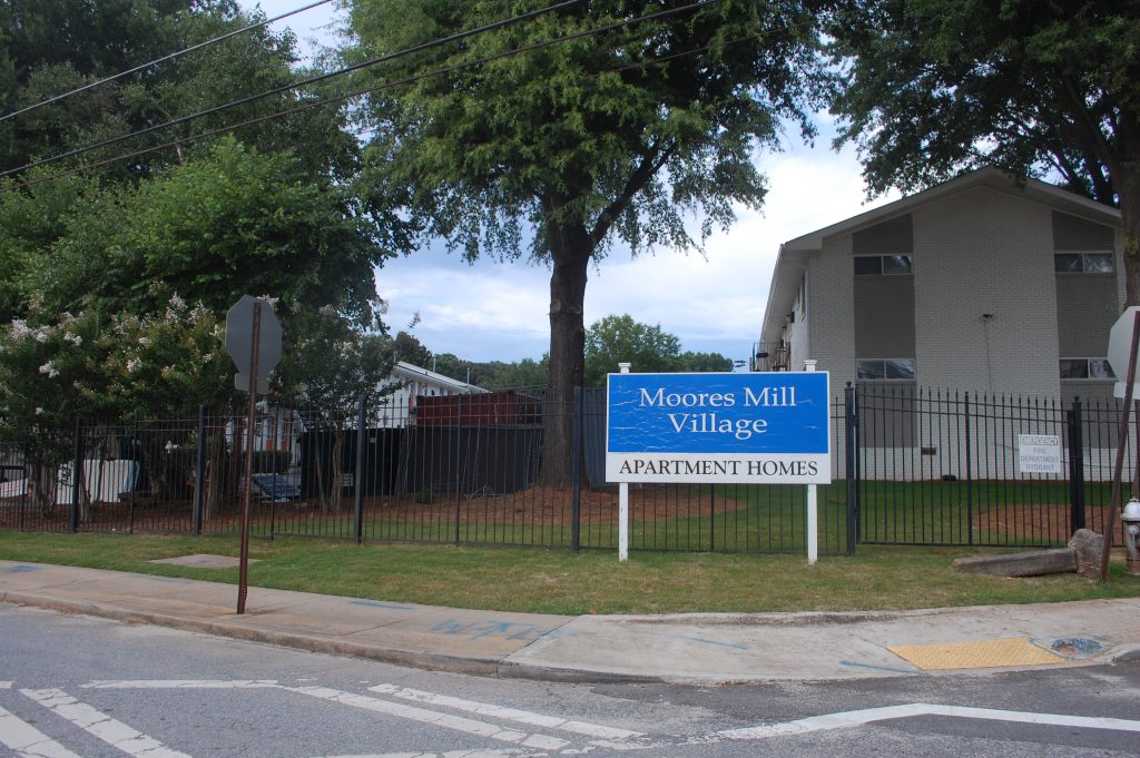 The families of Moores Mill Village, at the edge of Buckhead, largely identify as Black or Latino.