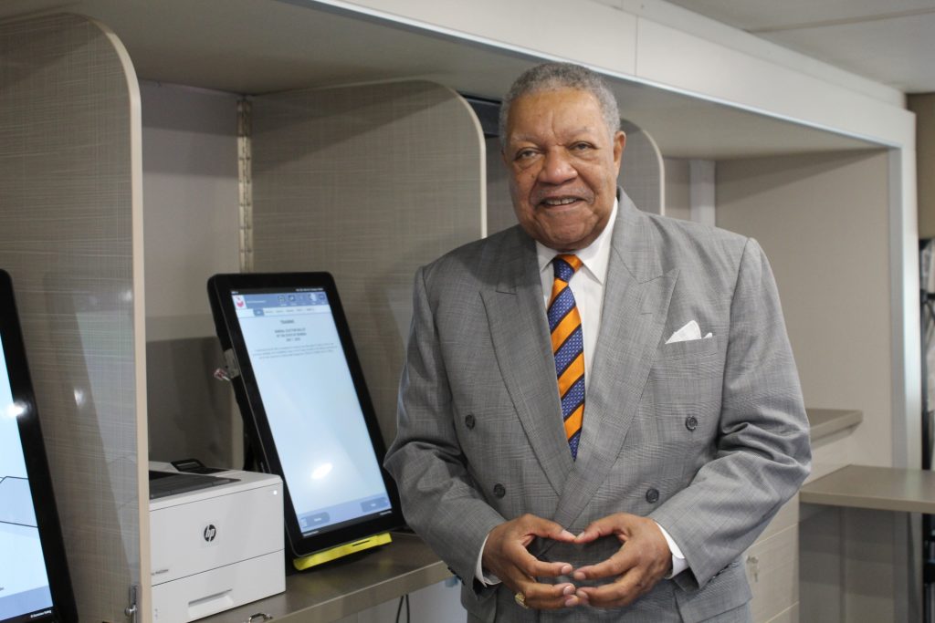 Fulton County Commission Chair Robb Pitts stands inside the county's new mobile voting unit. (Emil Moffatt/WABE)
