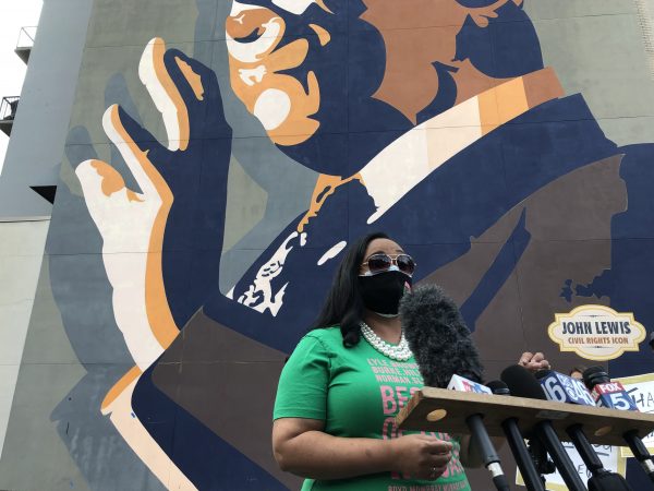 Congresswoman-elect Nikema Williams celebrated the win of Vice President-elect Kamala Harris at the mural of the late Congressman John Lewis, who she is set to replace. (Stephannie Stokes/WABE)