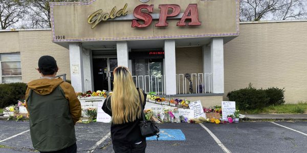 People view a makeshift memorial Friday at Gold Spa in Atlanta.