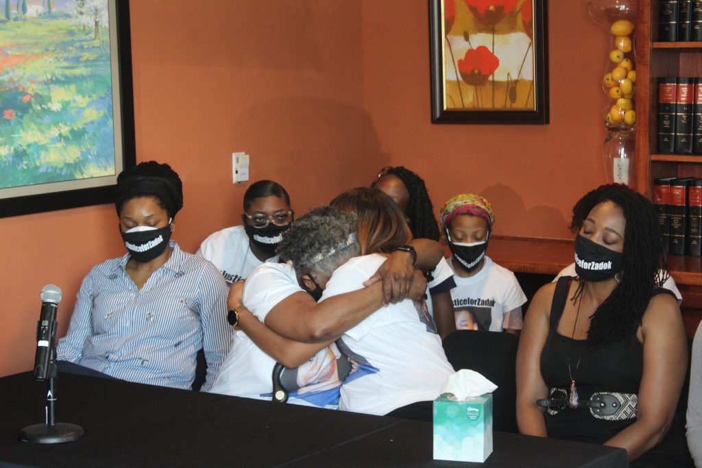 The five sisters and mother of Matthew Zadok Williams gathered for a press conference Tuesday about the fatal shooting of Williams by police. (Johnny Kauffman/WABE)