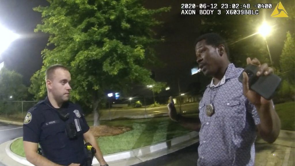 Atlanta police officer Garrett Rolfe, left, faces charges in the shooting death of Rayshard Brooks last year. This June 12, 2020, file photo is from a screen grab taken from body camera video provided by the Atlanta Police Department. (Atlanta Police Department via AP, File)