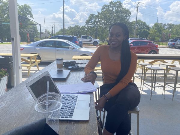 Joy Muhoza, 22, at Refuge Coffee Co. in Clarkston, GA.