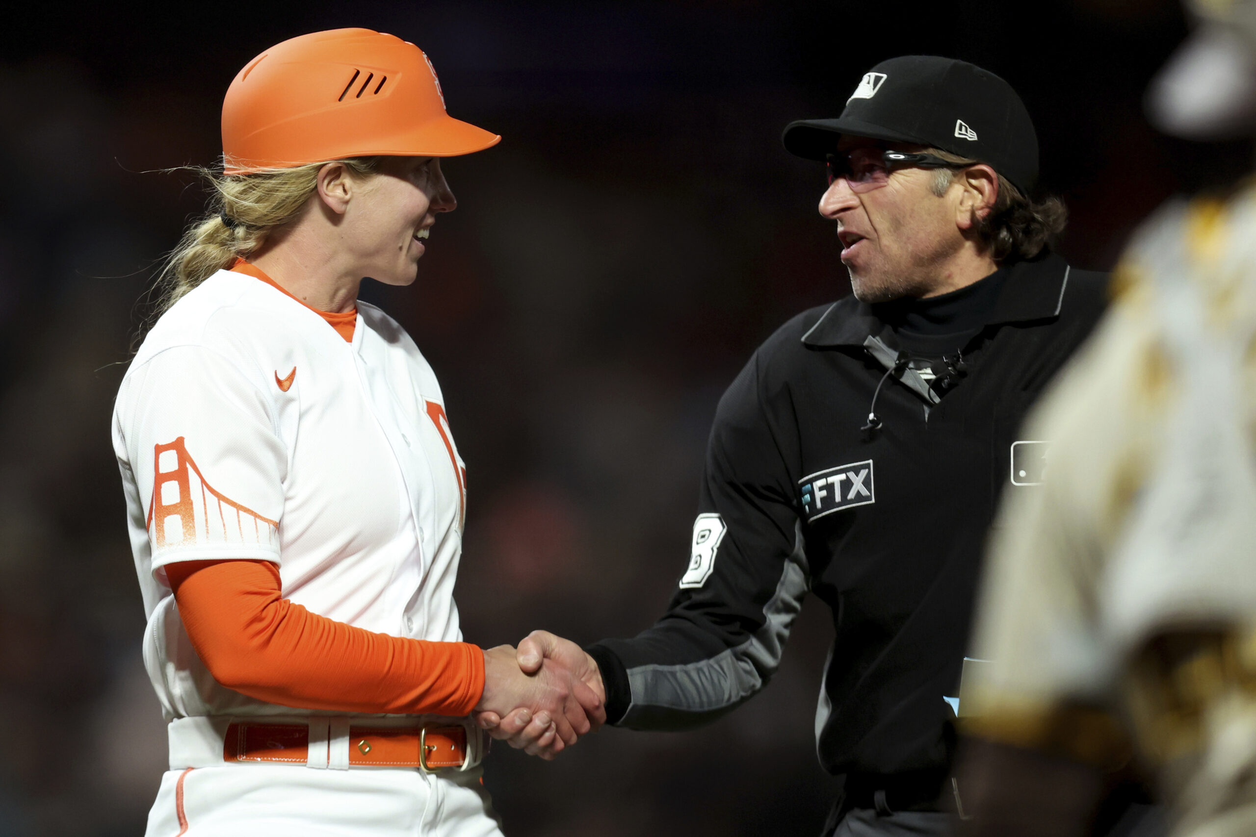 Alyssa Nakken becomes the first woman to coach on the field in MLB history  – WABE