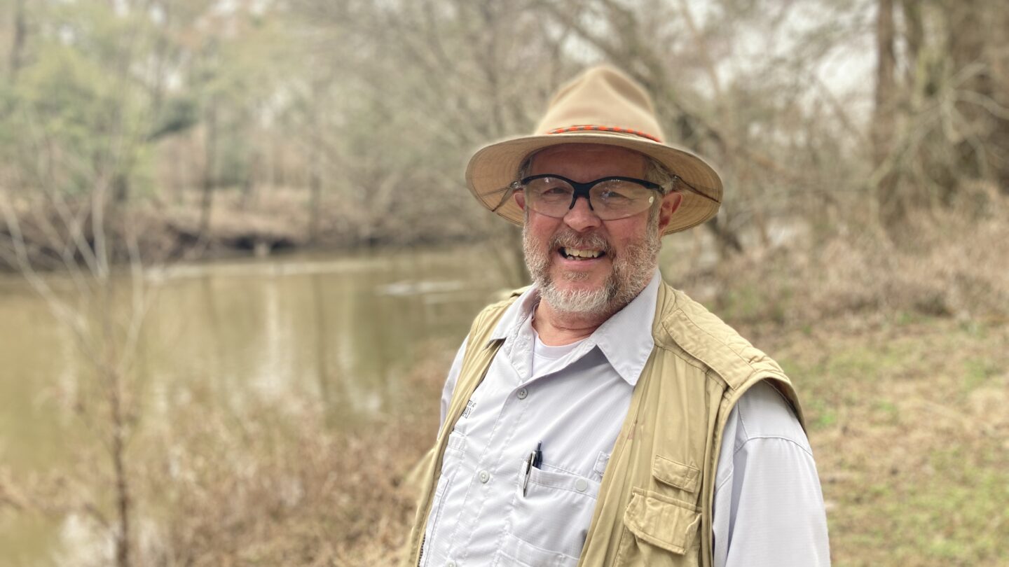 Aquatic biologist Steve Golladay stands on the bank of Ichawaynochaway Creek