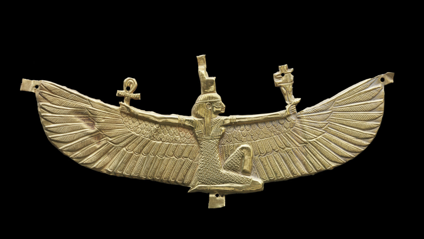 Gorgeous gold image of a woman with wings, holding an ankh and something else 