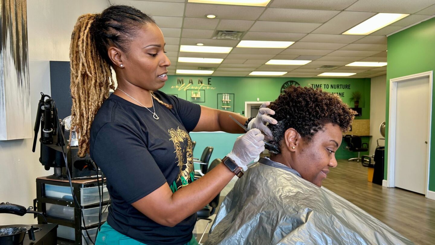 Yolanda Sterling co-owns Mane Nutrients Natural Hair Salon in Stone Mountain. She is participating in the national Confess Project, which trains stylists and barbers to become mental-health advocates. (Jess Mador/WABE)