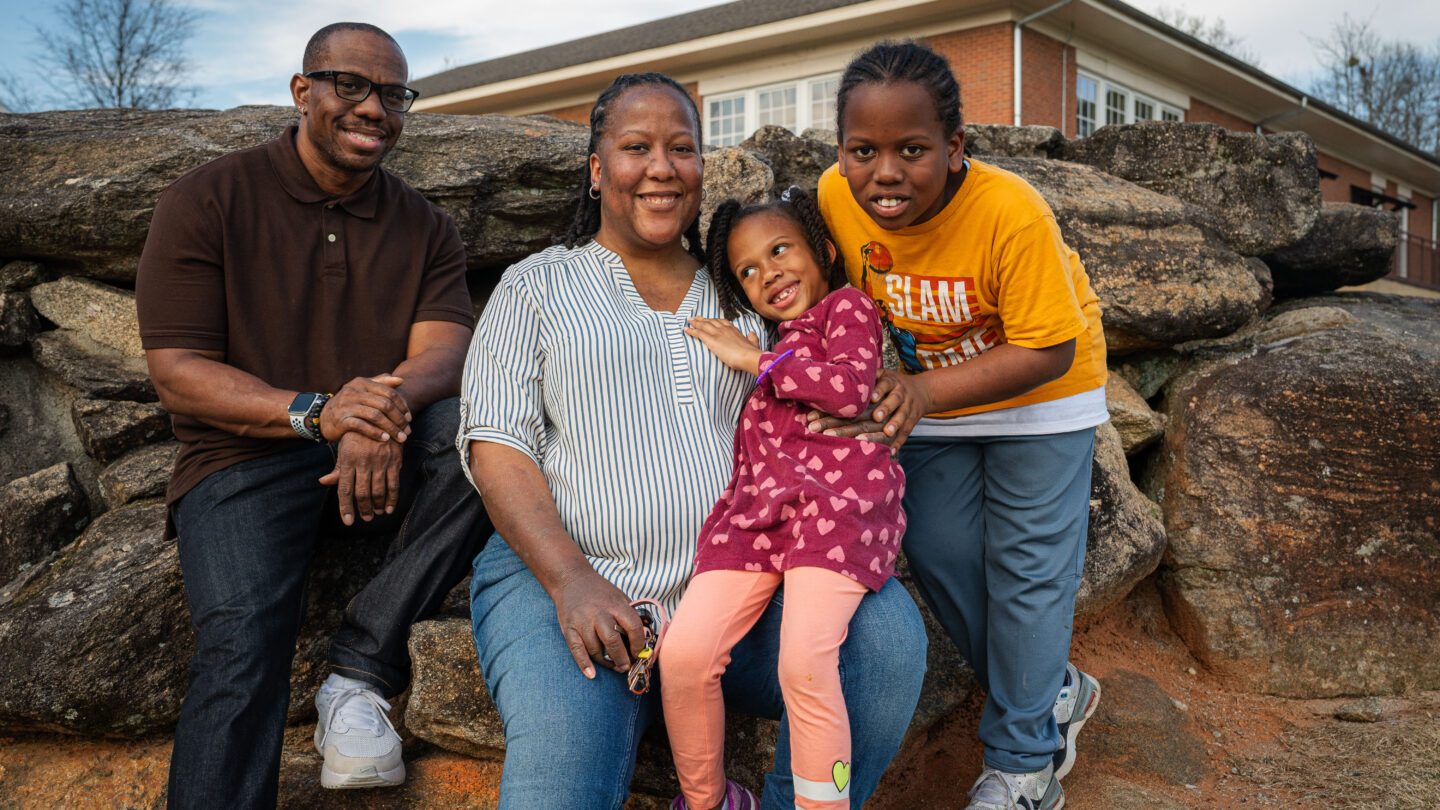 Heather Dobbs pictured with her husband, Michael, and children Cameron and Claire. Dobbs advocates for women to have more support during and after pregnancy. She survived severe complications during the birth of her daughter. (WABE/Matt Pearson)