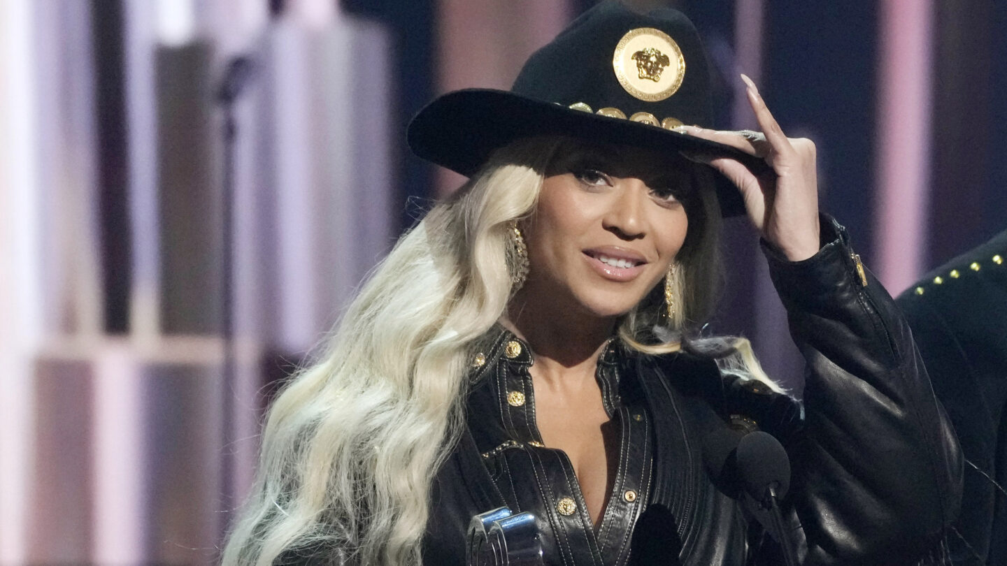 Beyonce, wearing a black cowboy outfit, accepts the Innovator Award during the iHeartRadio Music Award