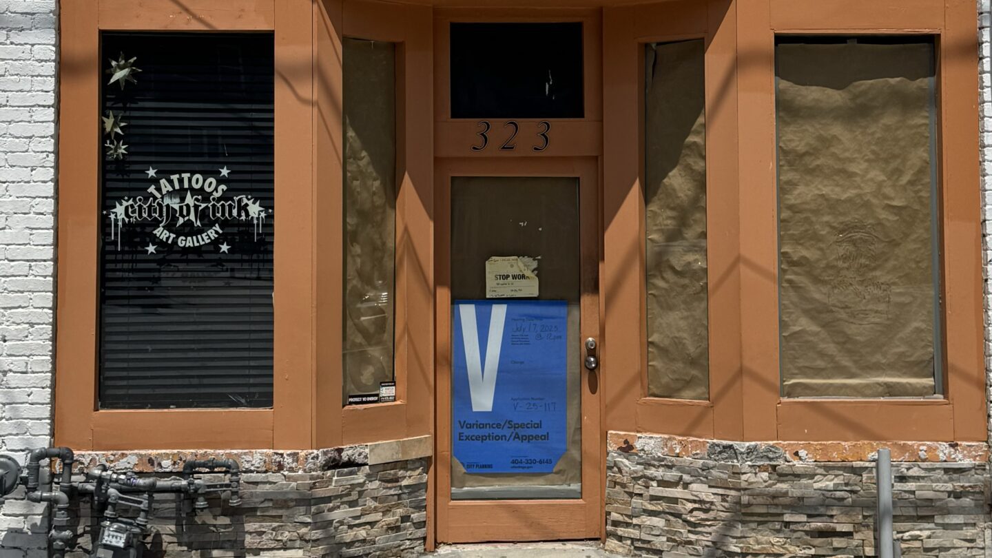 The closed storefront of City of Ink