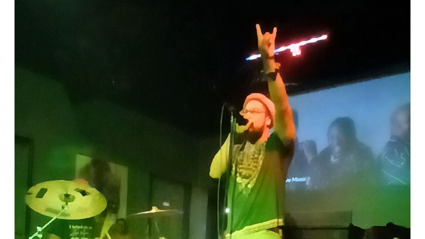 man on stage singing