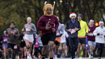 Runners participate in the Thanksgiving Half Marathon, Thursday, Nov. 23, 2023, in Atlanta