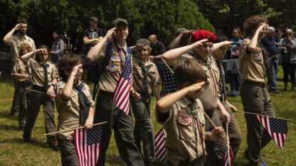 Members of the Boy Scouts salute during the 157th Brooklyn Memorial Day Parade, Monday, May 27, 2024, in New York