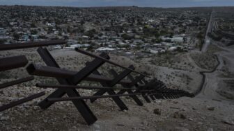 Barriers form part of the U.S.-Mexico border fence as they run along mountainous terrain overlooking Mexico's Ciudad Juárez on Wednesday, July 23, 2025, in Sunland Park, N.M.