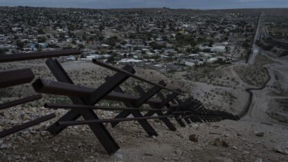 Barriers form part of the U.S.-Mexico border fence as they run along mountainous terrain overlooking Mexico's Ciudad Juárez on Wednesday, July 23, 2025, in Sunland Park, N.M.