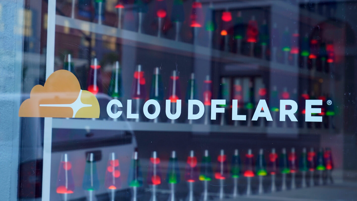 Lava lamps are seen through a lobby window at the headquarters of Cloudflare in San Francisco, Wednesday, Aug. 31, 2022.