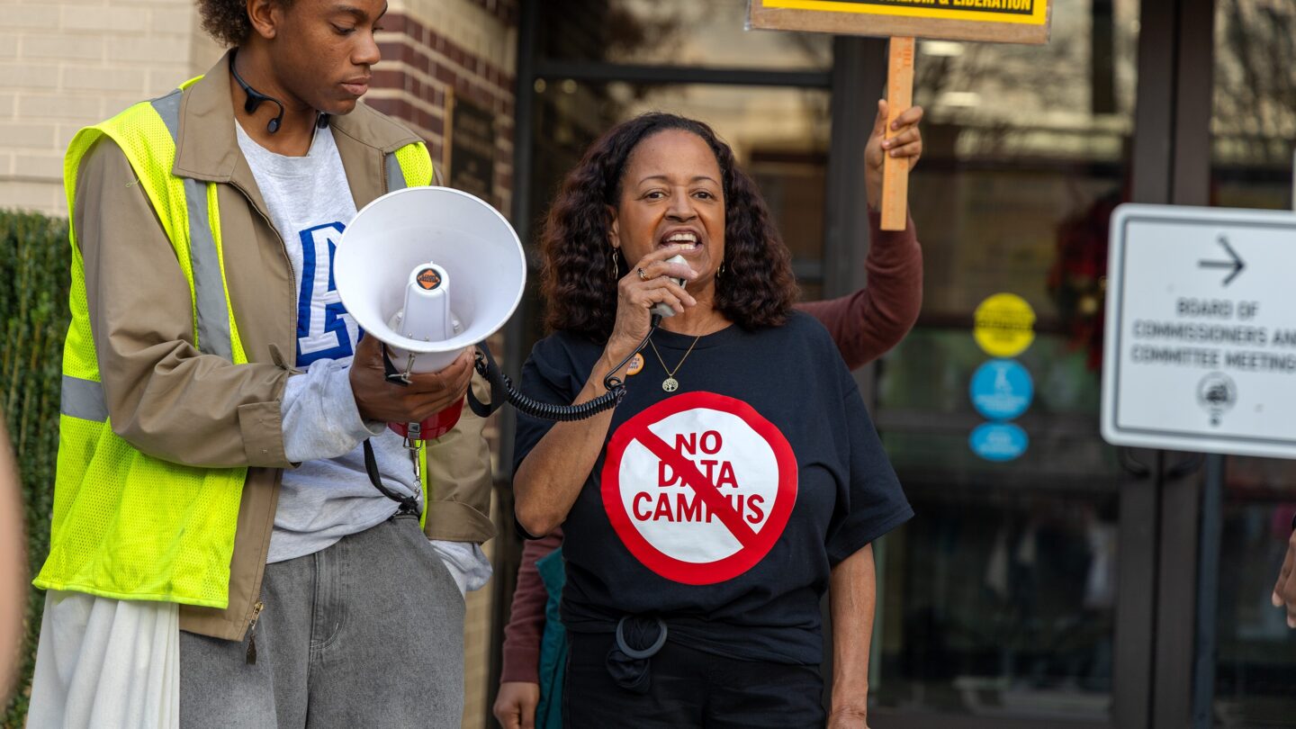 DeKalb resident Gina Mangham speaks during a rally against data centers at the DeKalb Government Service Center ahead of the county commission's zoning meeting on Nov. 20, 2025.