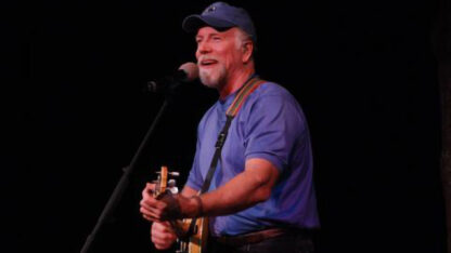 Man playing guitar on stage