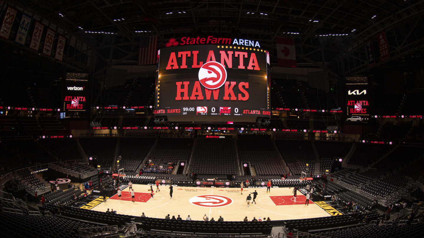 The Atlanta Hawks name and logo are projected inside the State Farm Arena