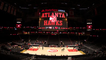 The Atlanta Hawks name and logo are projected inside the State Farm Arena