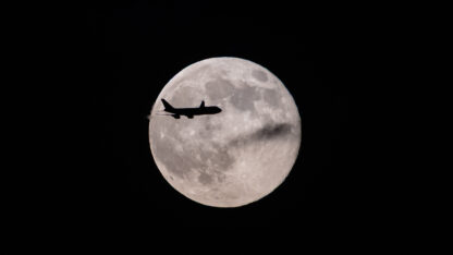 A UPS Boeing 747 inbound from Anchorage, Alaska, passes in front of the supermoon as it approaches Louisville Muhammad Ali International Airport on Wednesday, Nov. 5, 2025, in Louisville, Ky.