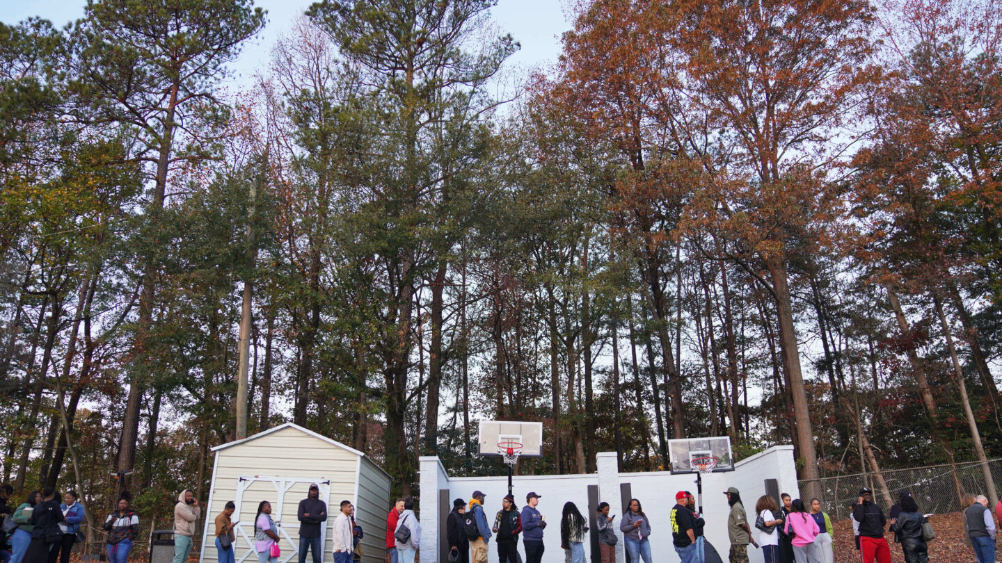 A line of people outside.