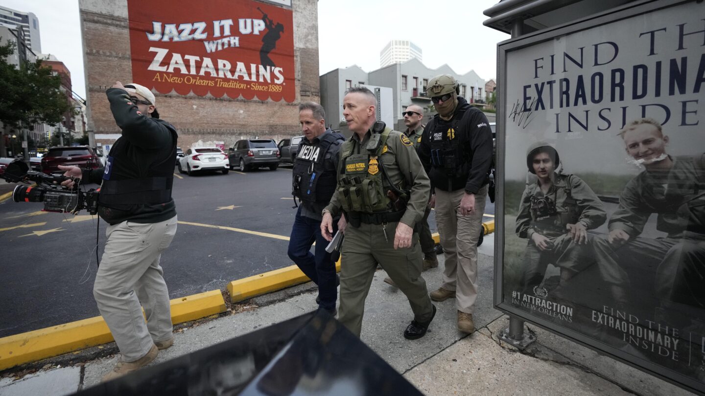 U.S. Border Patrol Commander at large Gregory Bovino, 3rd left, walks on the street in New Orleans, La., Wednesday, Dec. 3, 2025