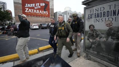 U.S. Border Patrol Commander at large Gregory Bovino, 3rd left, walks on the street in New Orleans, La., Wednesday, Dec. 3, 2025