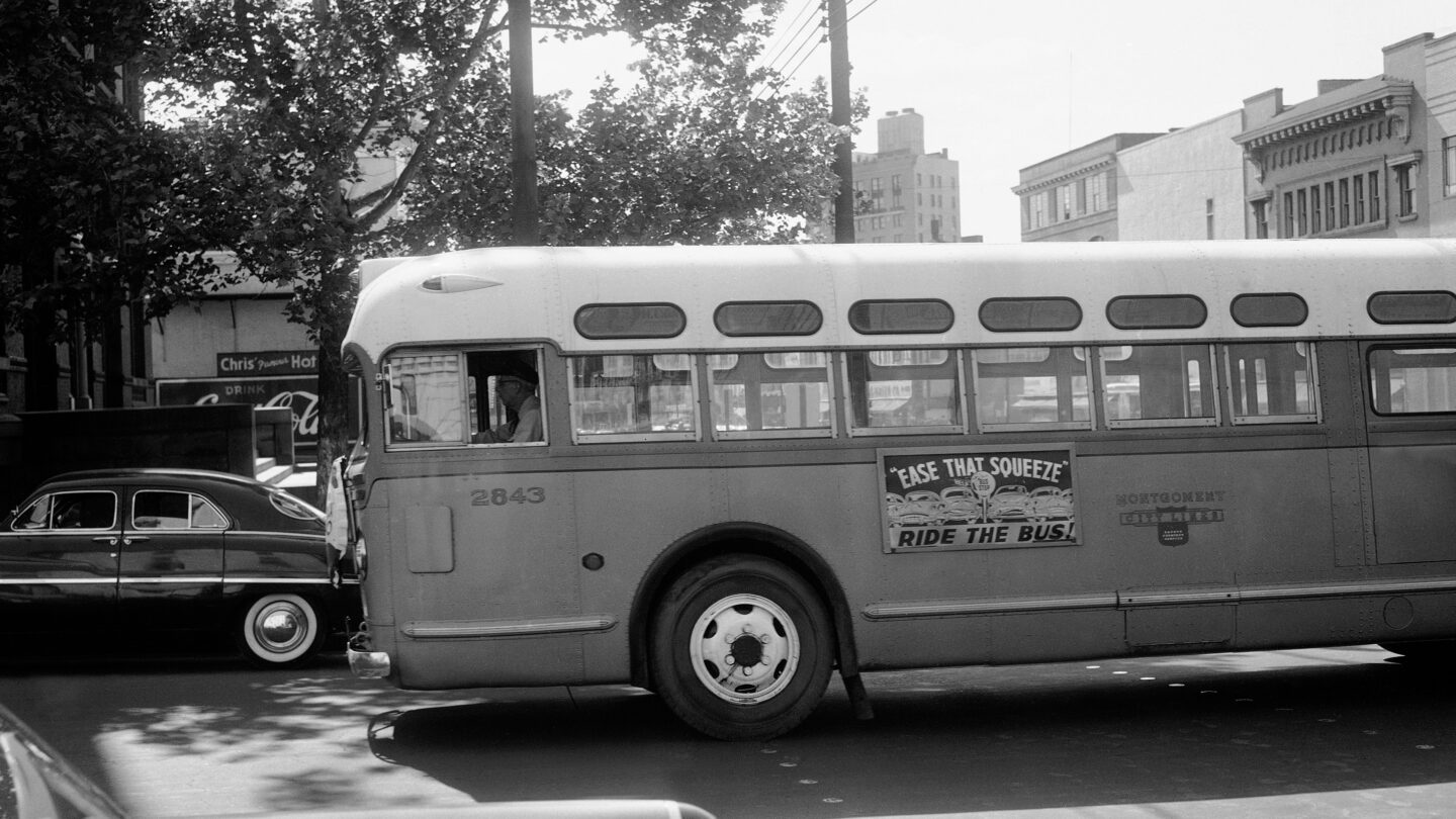 A black and white photo of a bus in Alabama in 1956.