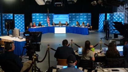People on the cdc vaccine advisory committee on immunization practices sit around tables