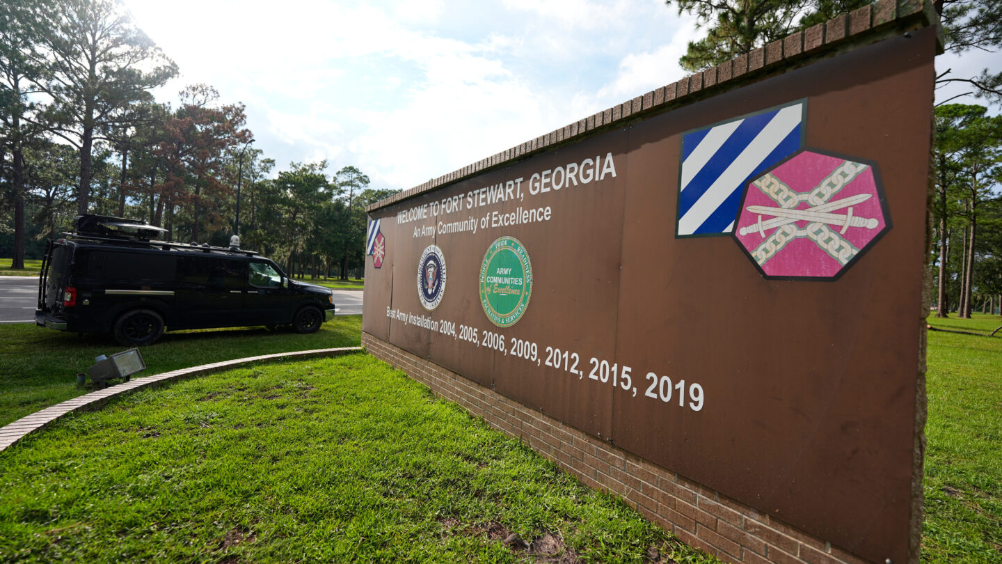 A brown sign for Fort Stewart
