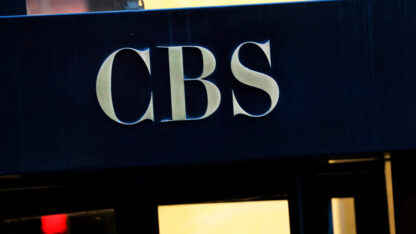 The CBS logo is on the front of a building in New York