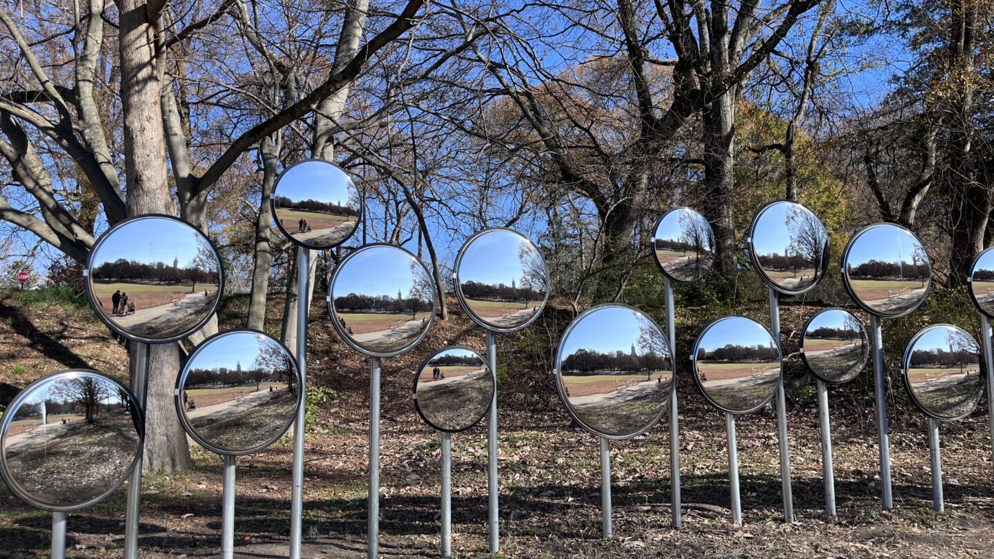 Mirrored installation “Myriad”, reflecting park paths and trees.