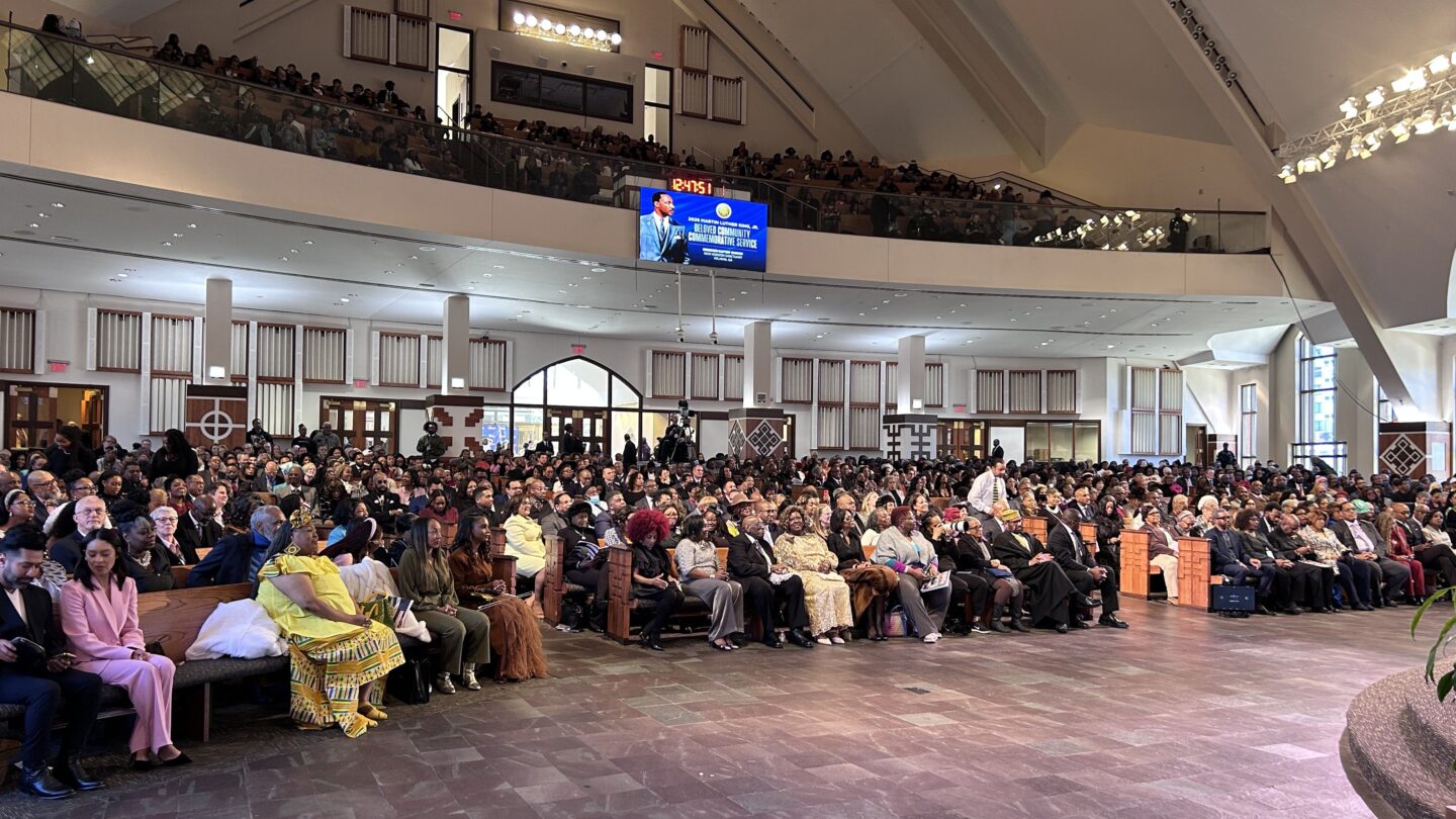 A crowd of people inside a church during a service