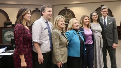 A group of Roswell officials pose for a photograph at Roswell City Hall