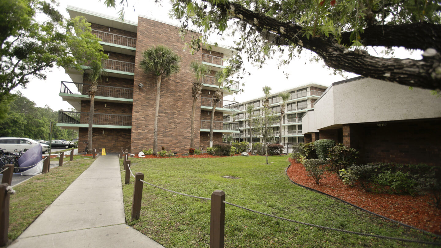 The red brick building of an extended stay hotel