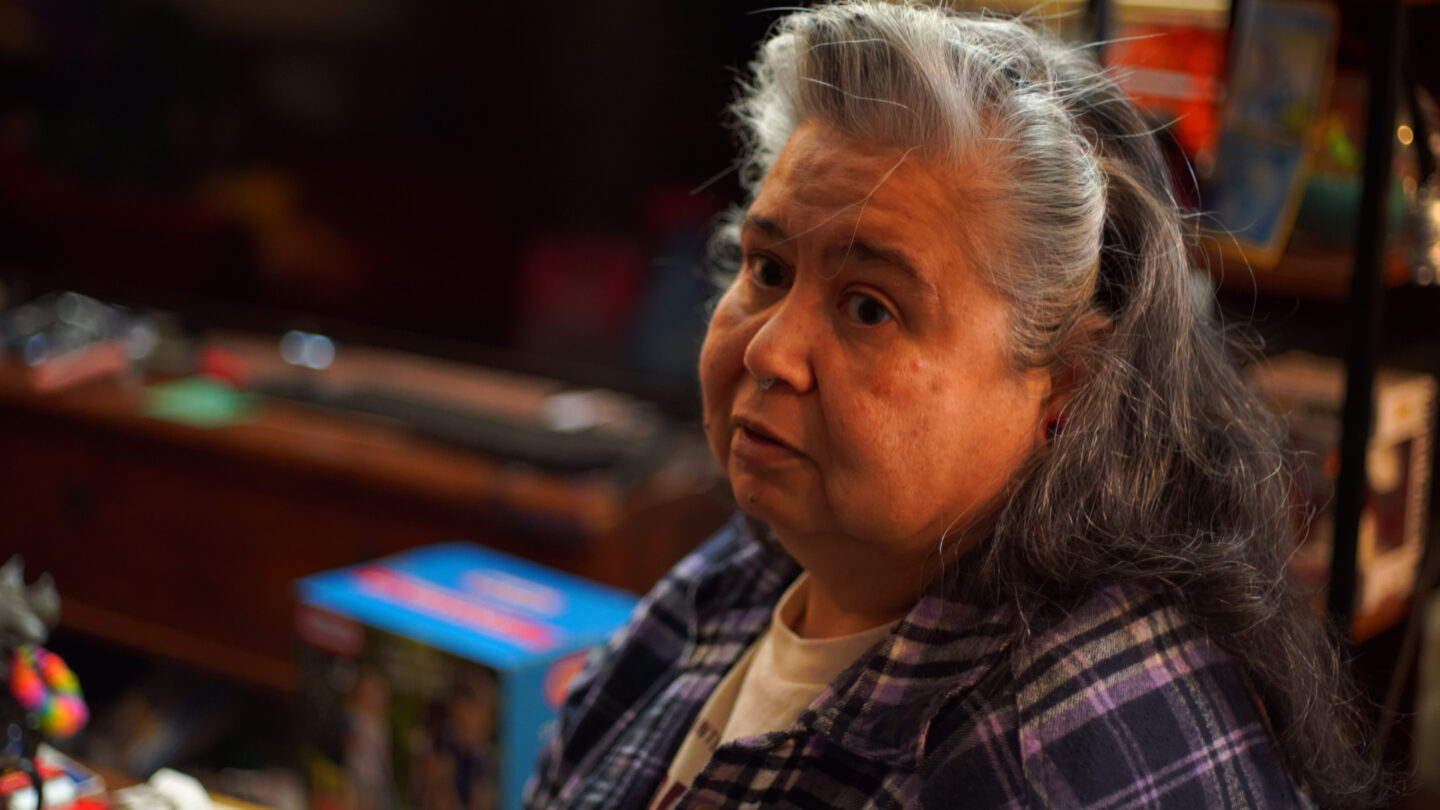 A woman looks to the left