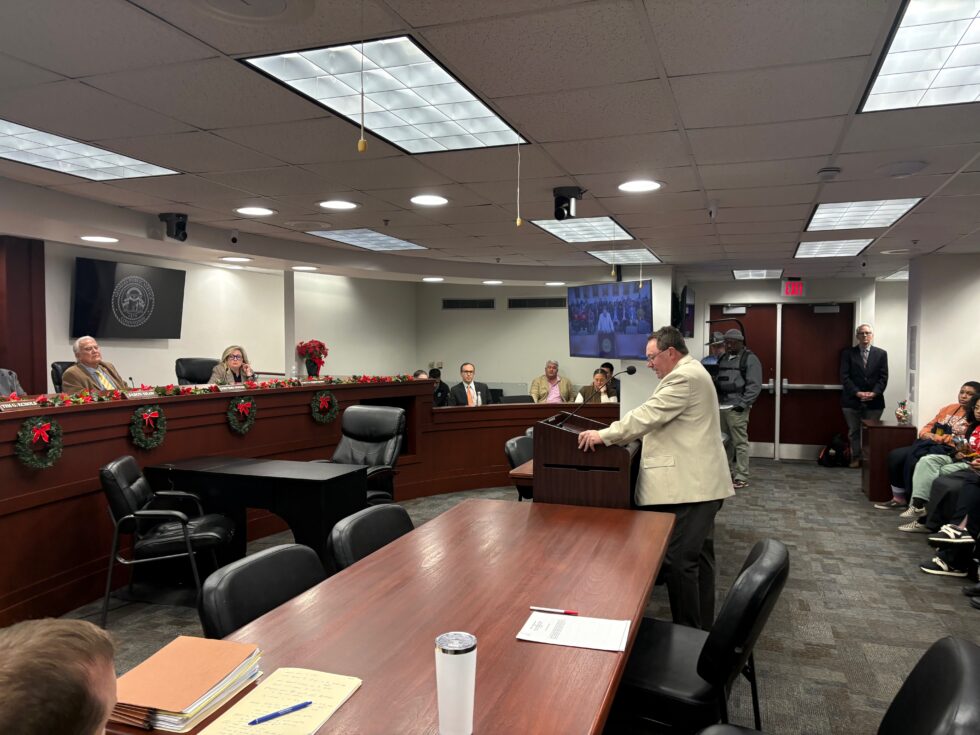 Randy Beall stands at a podium in front of the Georgia Public Service Commission.