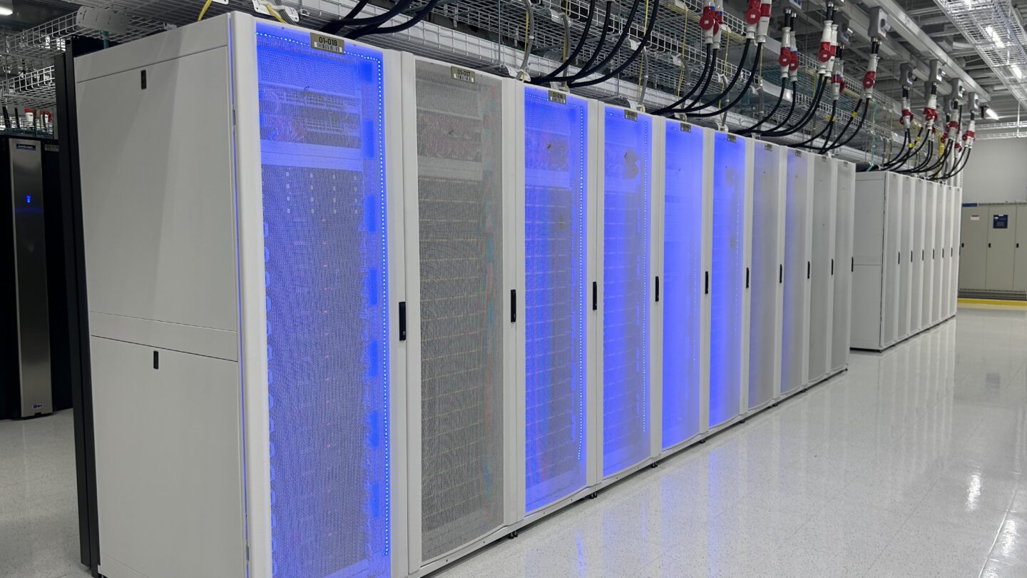 The glowing blue interior of a data center