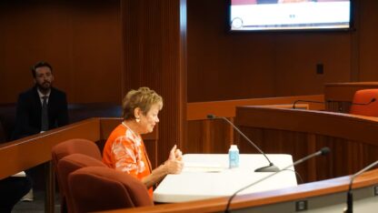 Dr. Kathleen Toomey speaks to state legislators during an August committee meeting.