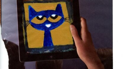Hand holds a tablet displaying a Pete the Cat painting.